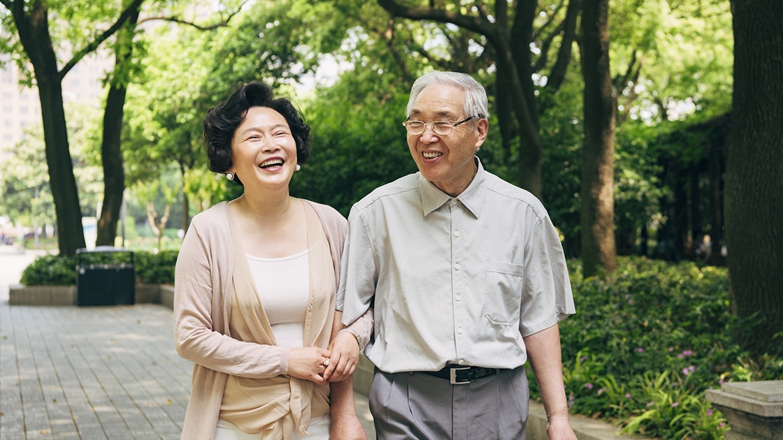 Dental Implant Patients mature couple smiling and walking